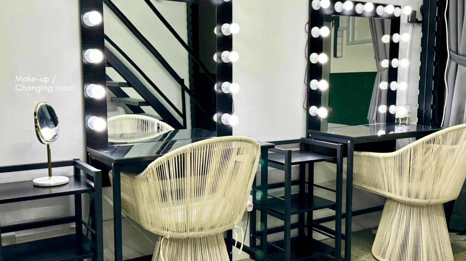 Makeup room with Hollywood mirrors and styling chairs