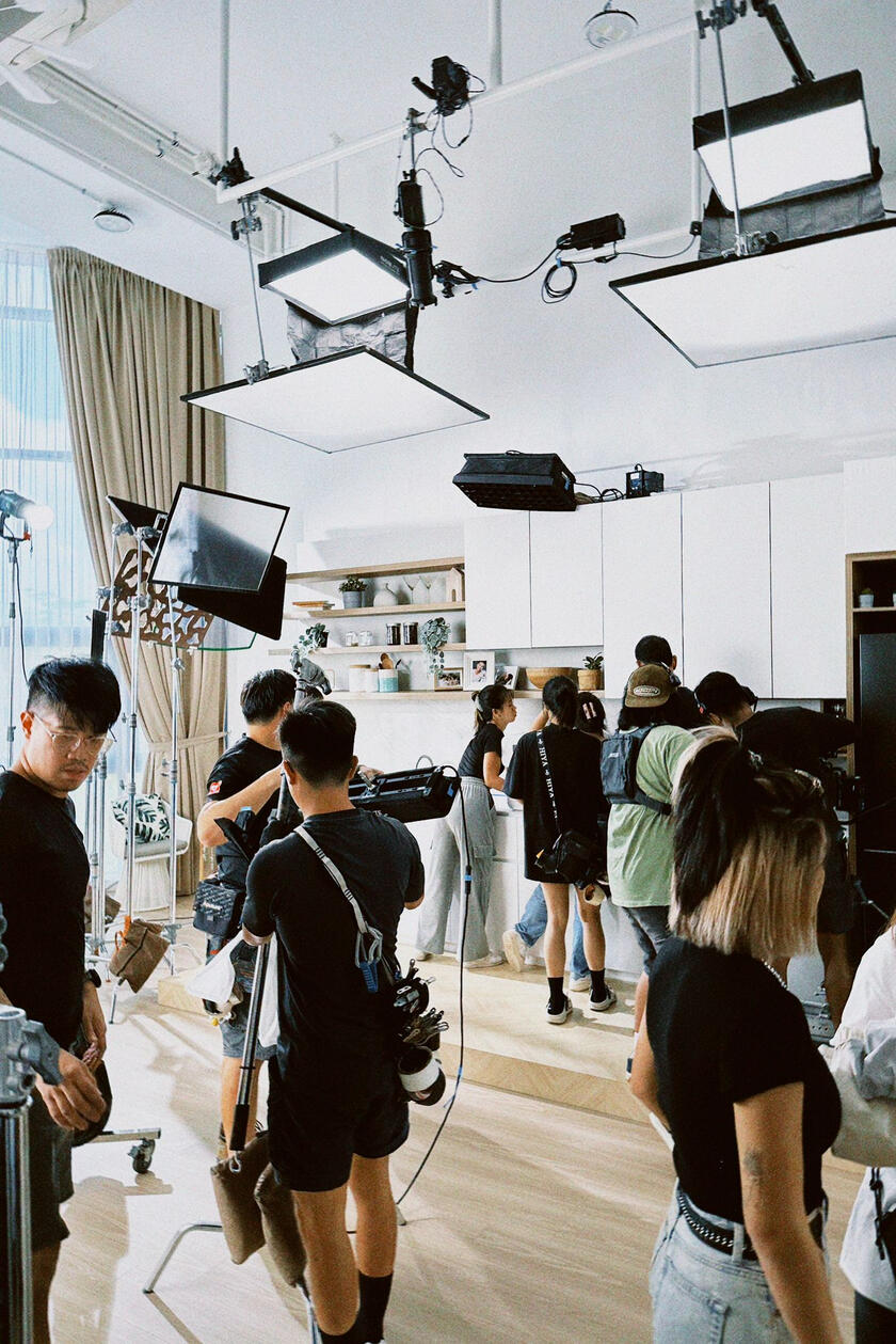 Crew filming on set at Aria Atelier